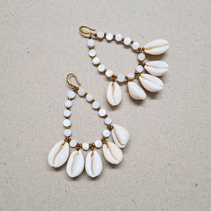 COWRIE SHELL STATEMENT DROP EARRINGS IN GOLD FINISH