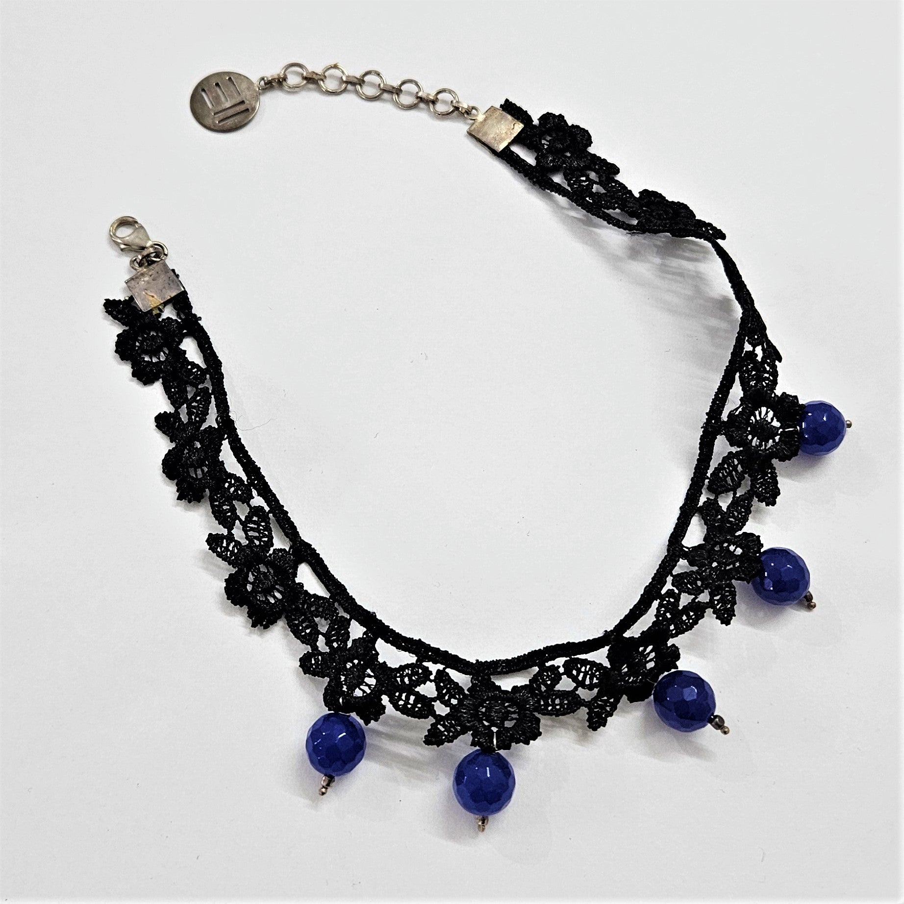 Black lace choker with floral detailing  with blue semi precious onyx beads hanging down with 925 silver fastenings