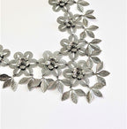 3d sculpted flower necklace with brass carved leaves