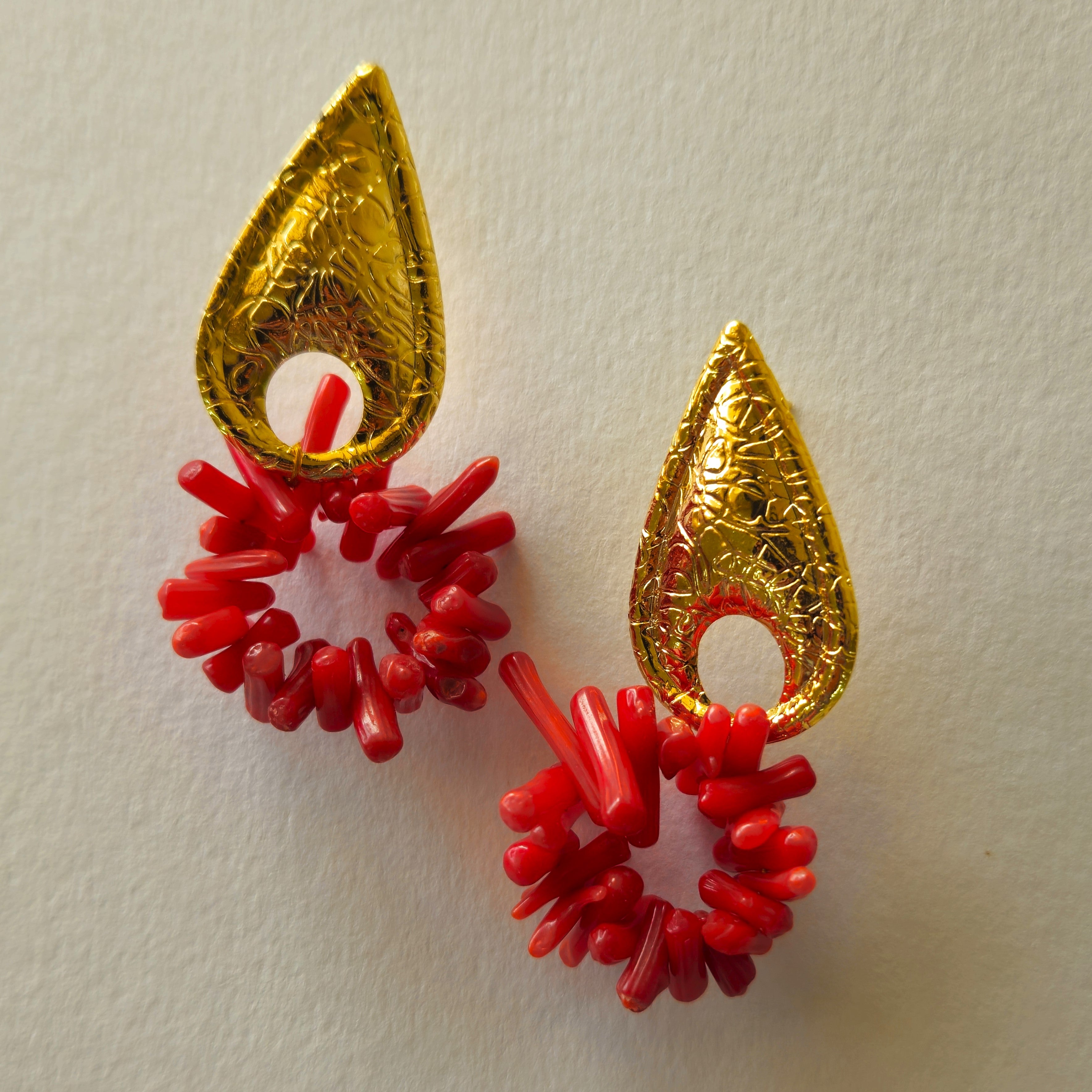 DROP SHAPED BRASS WITH FLORAL ENGRAVING WITH CORAL BEADS HUNG DOWN IN A HOOP